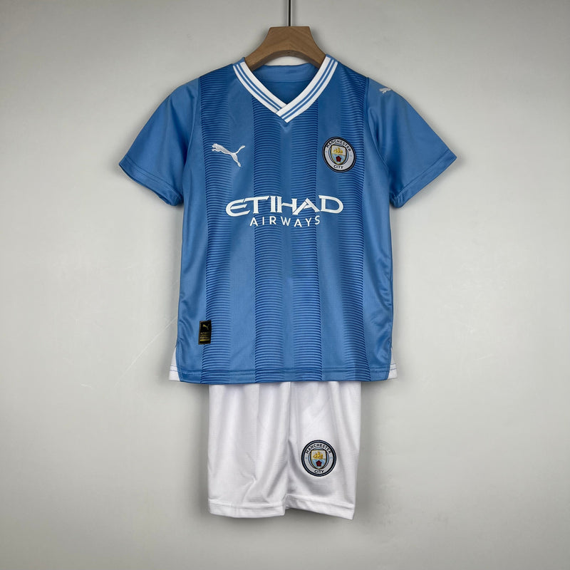 CAMISOLA MANCHESTER CITY I 23/24 CONJUNTO INFANTIL