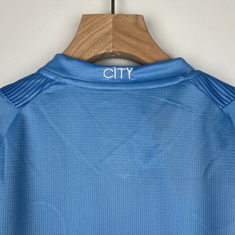 CAMISOLA MANCHESTER CITY I 23/24 CONJUNTO INFANTIL